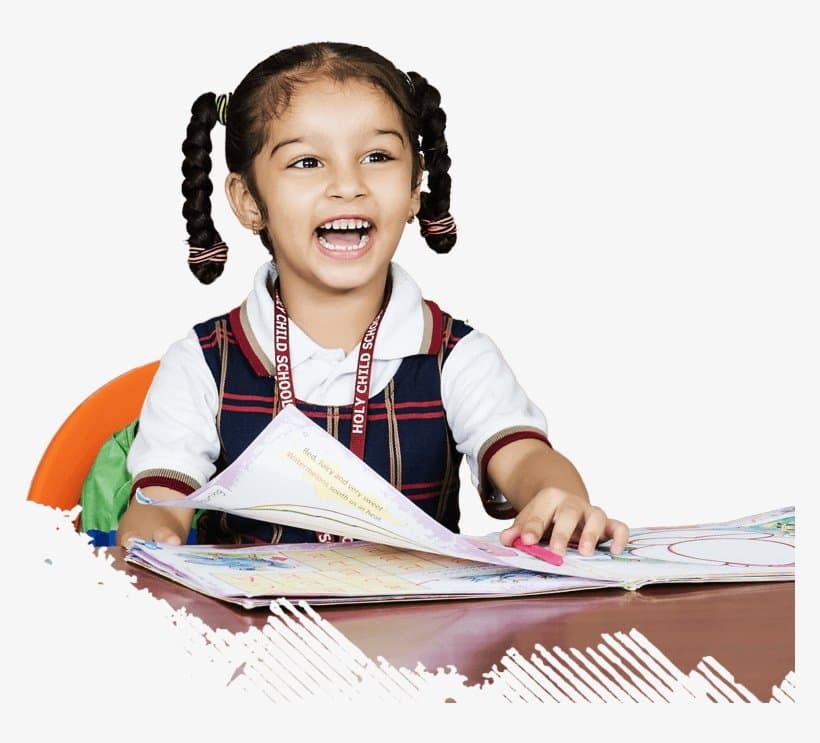 A cheerful young schoolgirl reading a book at her desk